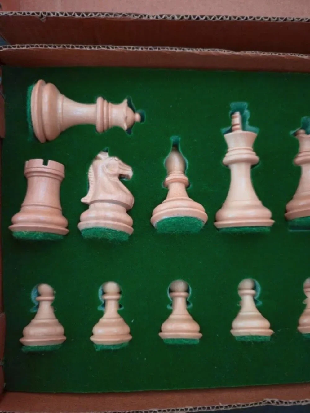 Vintage / new in holder. 17 piece wooden chess set with felt bottoms.